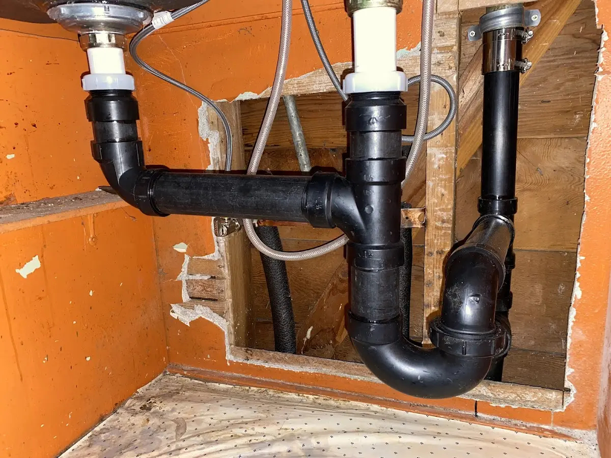 Professional Garbage Disposal Repair equipment and tools on the job in Jackson